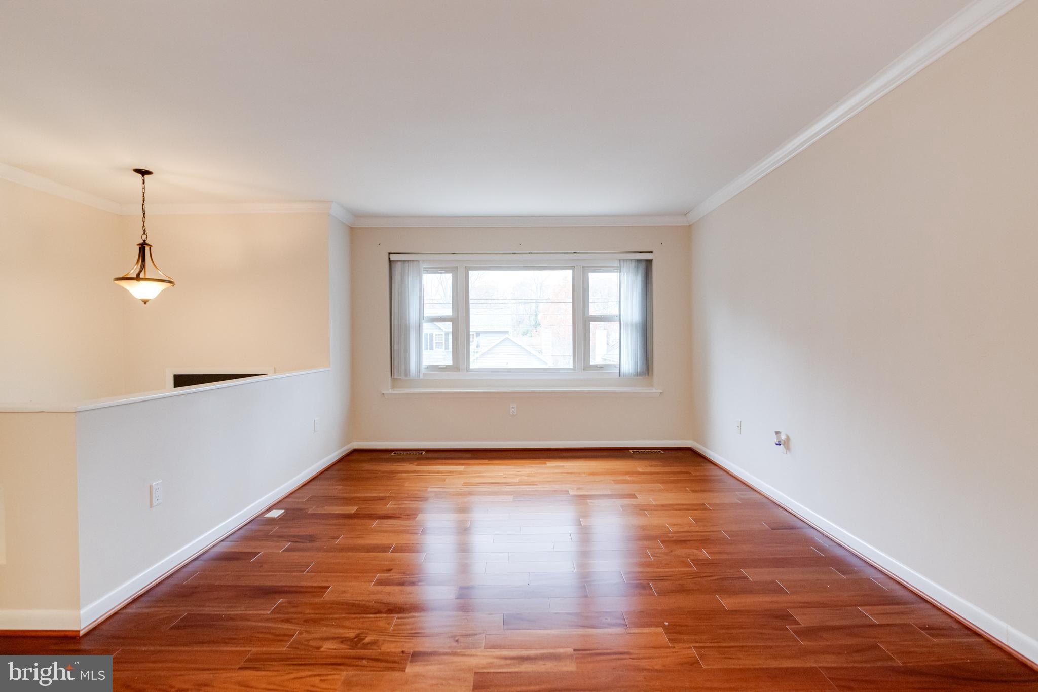 795 Windgate Drive Annapolis, MD 21409 - Photo 2 of 61 a view of empty room with wooden floor and fan