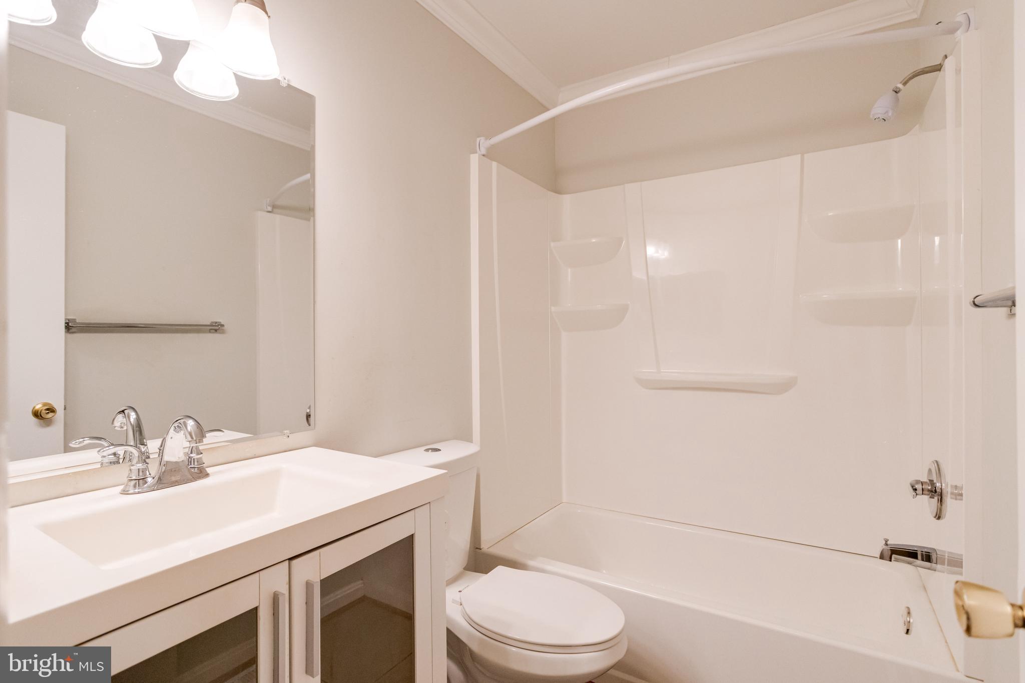 795 Windgate Drive Annapolis, MD 21409 - Photo 23 of 61 a bathroom with a sink a toilet and a bathtub