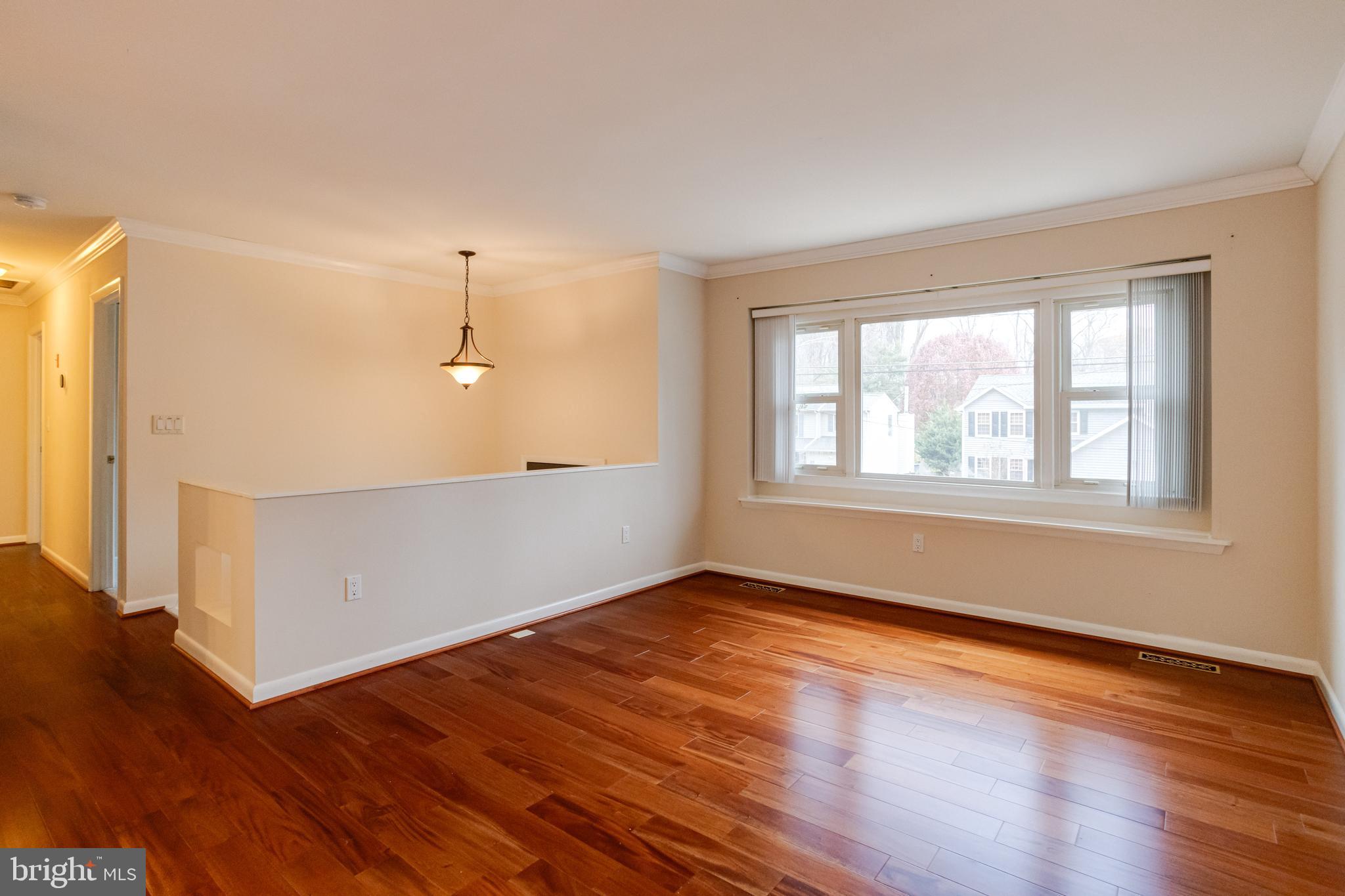 795 Windgate Drive Annapolis, MD 21409 - Photo 3 of 61 an empty room with wooden floor and windows