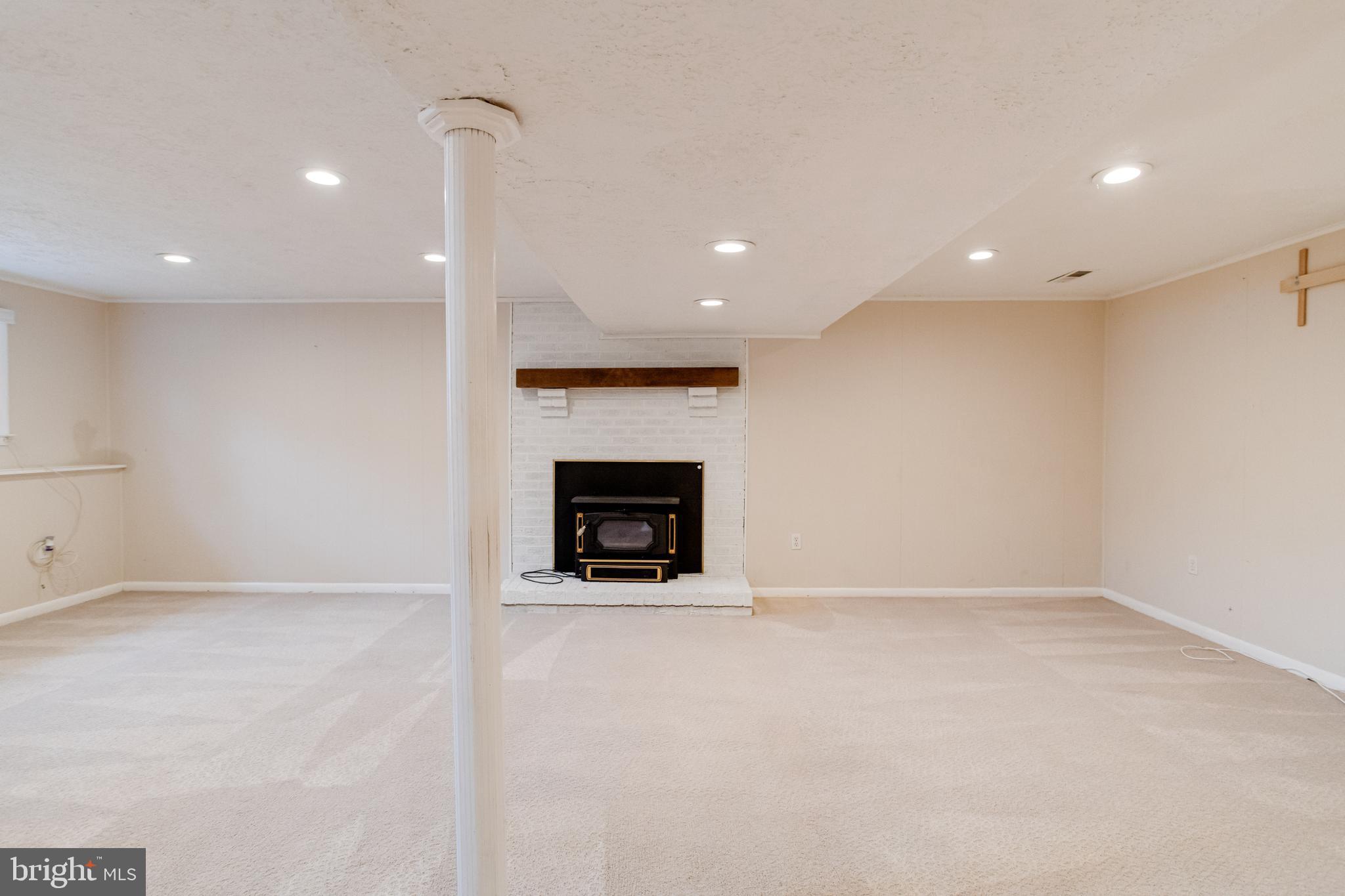 795 Windgate Drive Annapolis, MD 21409 - Photo 37 of 61 a view of an empty room with a fireplace