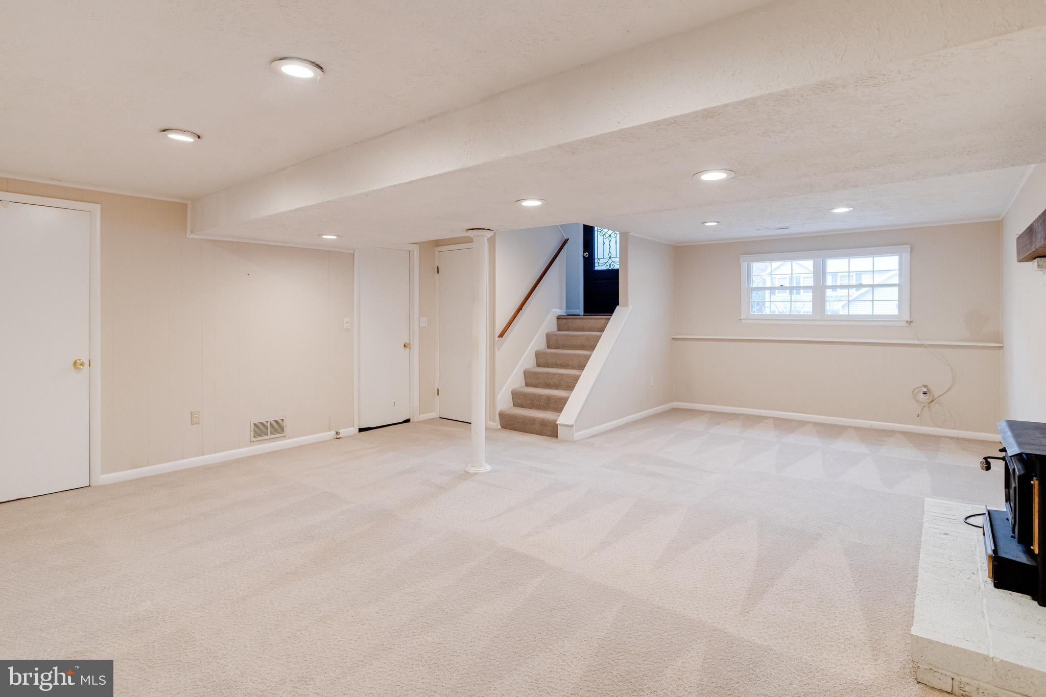 795 Windgate Drive Annapolis, MD 21409 - Photo 40 of 61 an empty room with a windows and staircase