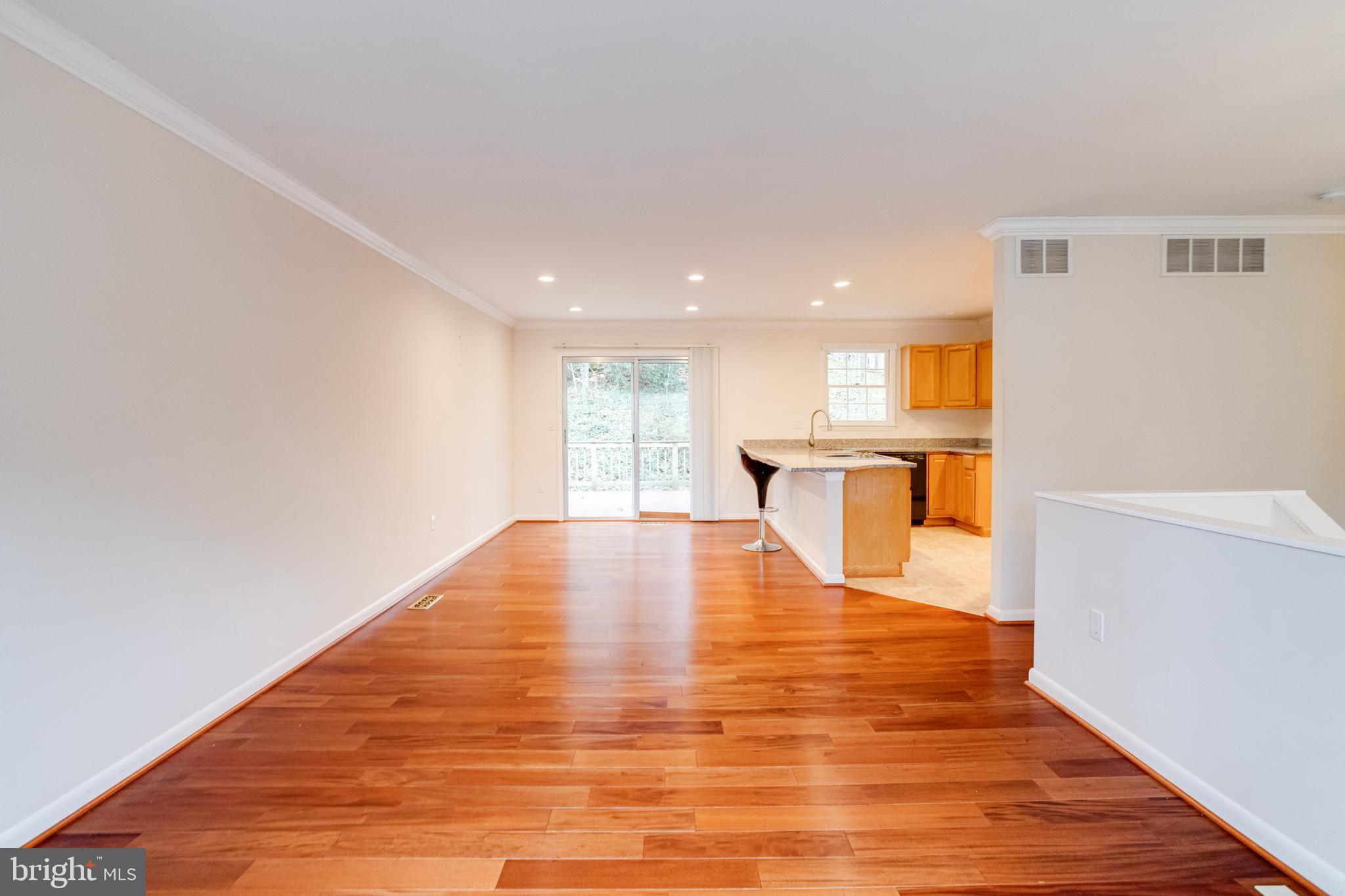 795 Windgate Drive Annapolis, MD 21409 - Photo 4 of 61 a view of an empty room with wooden floor and a window