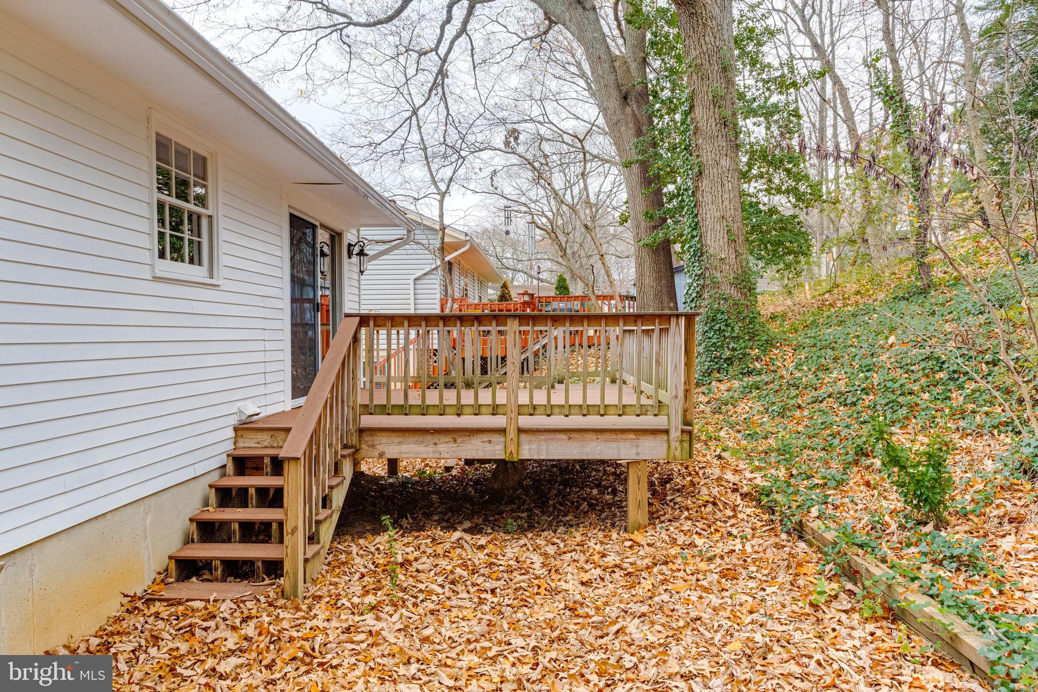 795 Windgate Drive Annapolis, MD 21409 - Photo 47 of 61 a view of a chairs setting in the backyard of a house