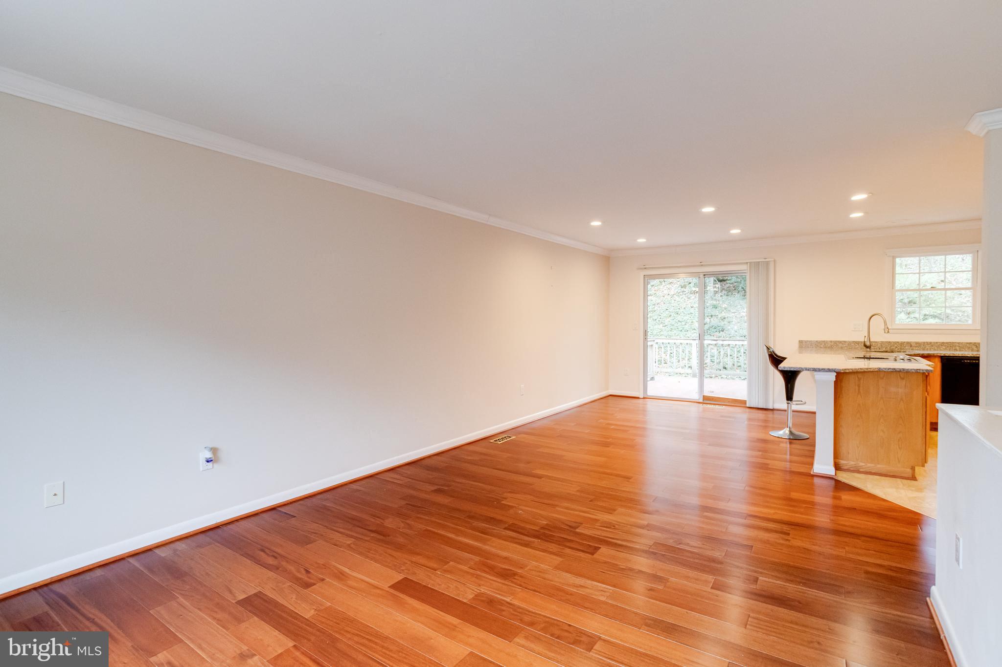 795 Windgate Drive Annapolis, MD 21409 - Photo 6 of 61 a view of empty room with wooden floor and window