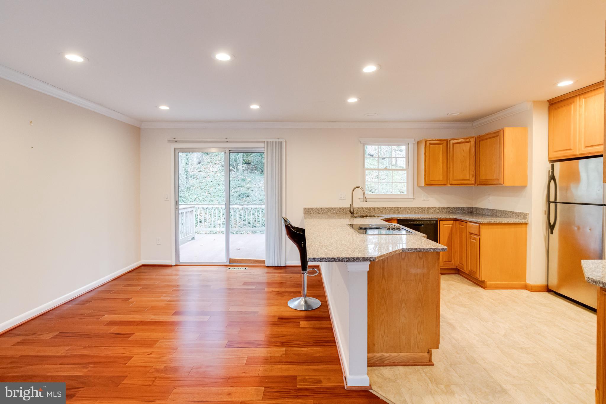795 Windgate Drive Annapolis, MD 21409 - Photo 8 of 61 a view of a kitchen with a sink and a refrigerator