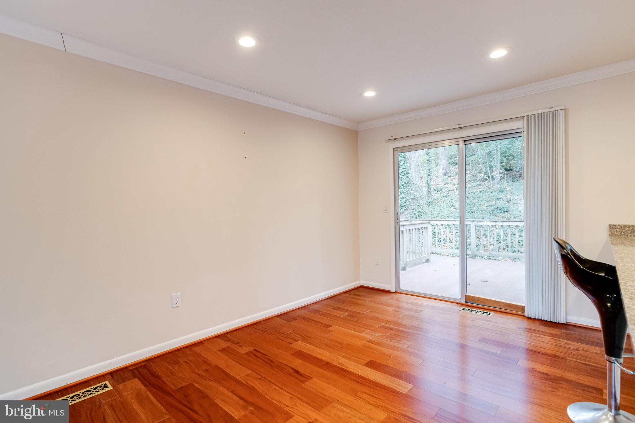 795 Windgate Drive Annapolis, MD 21409 - Photo 9 of 61 a view of empty room with wooden floor and fan