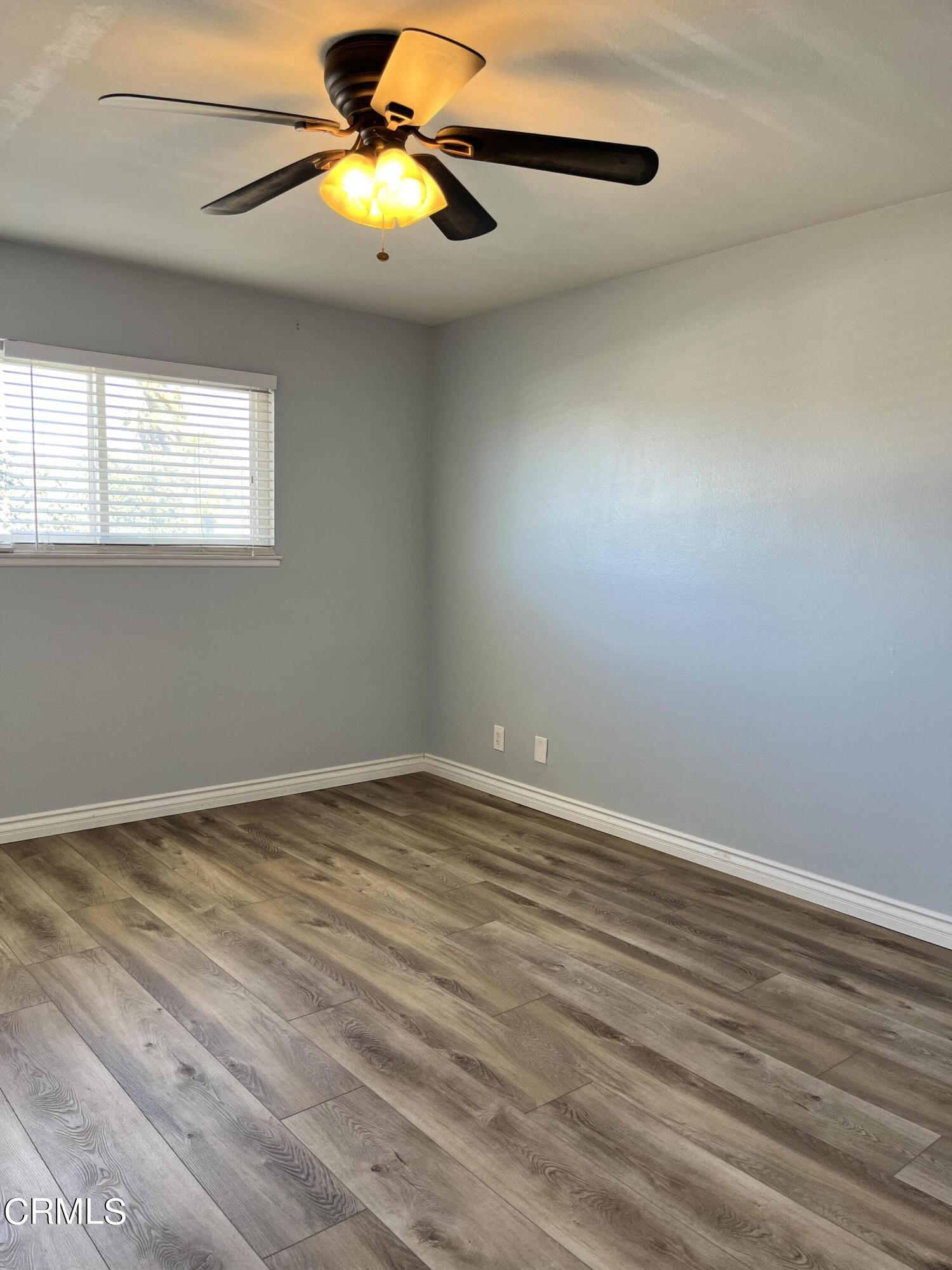 3540 Regatta Place Oxnard, CA 93035 - Photo 11 of 17 a view of an empty room with window and chandelier fan