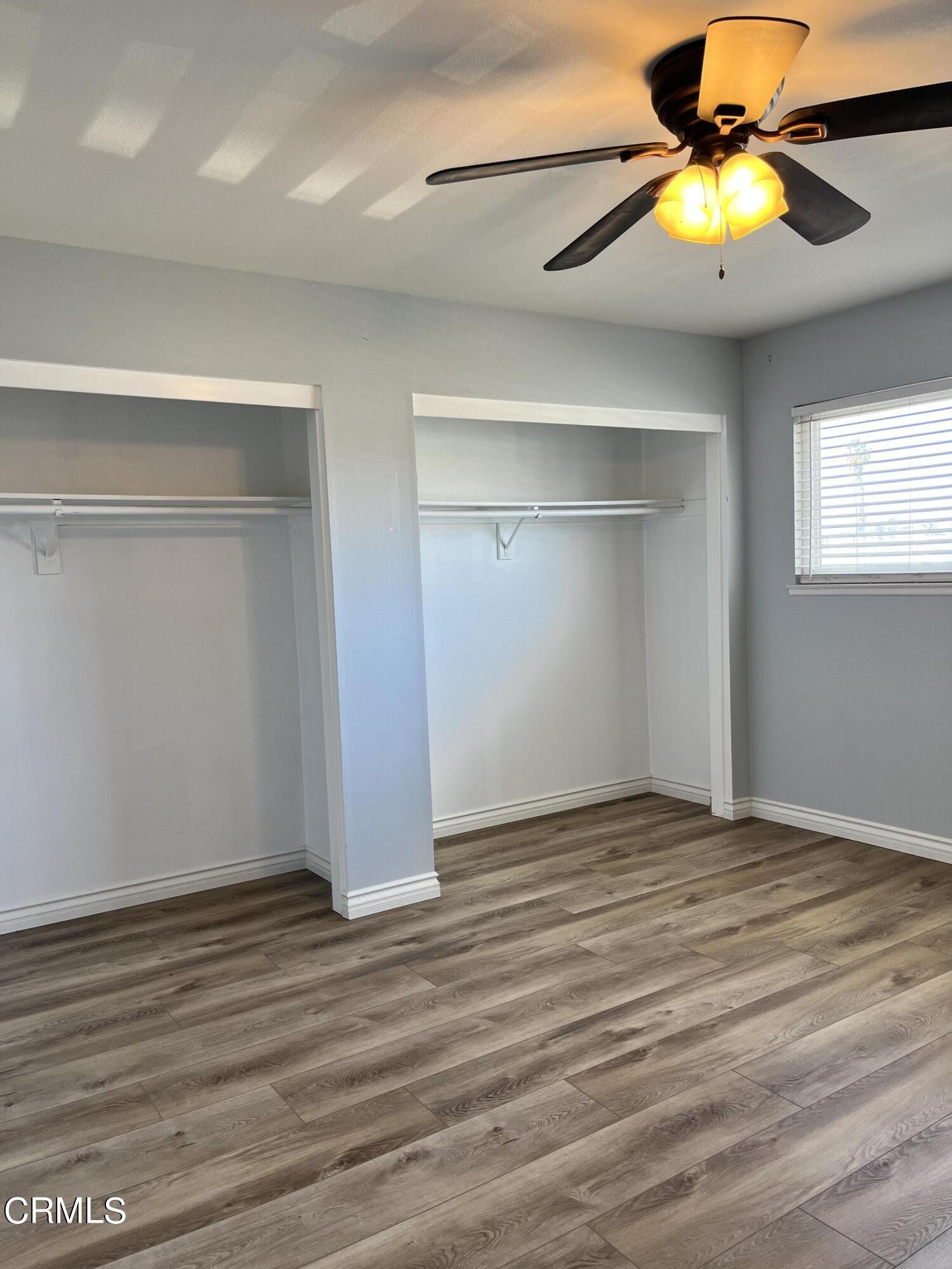 3540 Regatta Place Oxnard, CA 93035 - Photo 12 of 17 a view of an empty room with a window and wooden floor