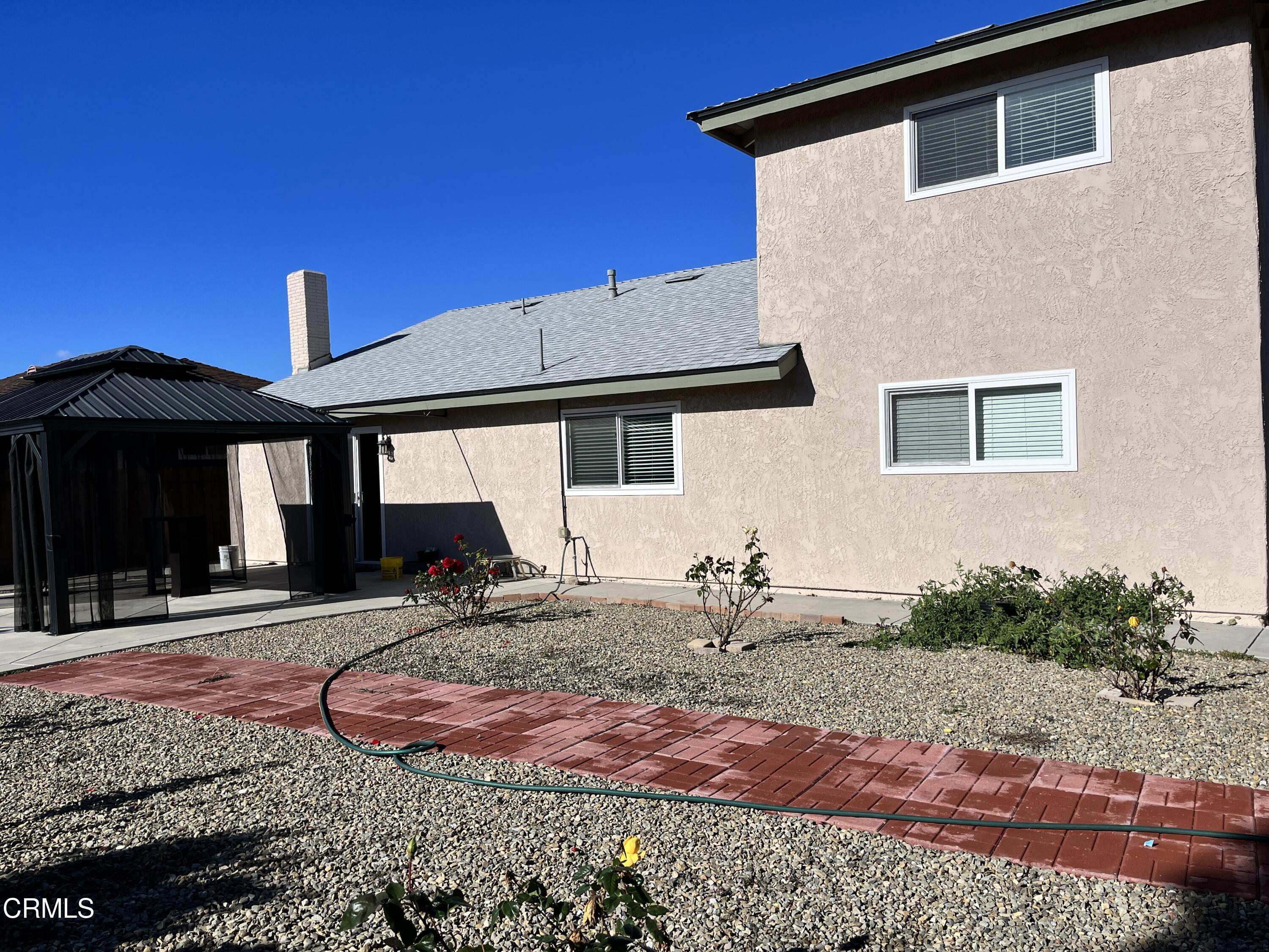 3540 Regatta Place Oxnard, CA 93035 - Photo 14 of 17 a front view of a house with garden
