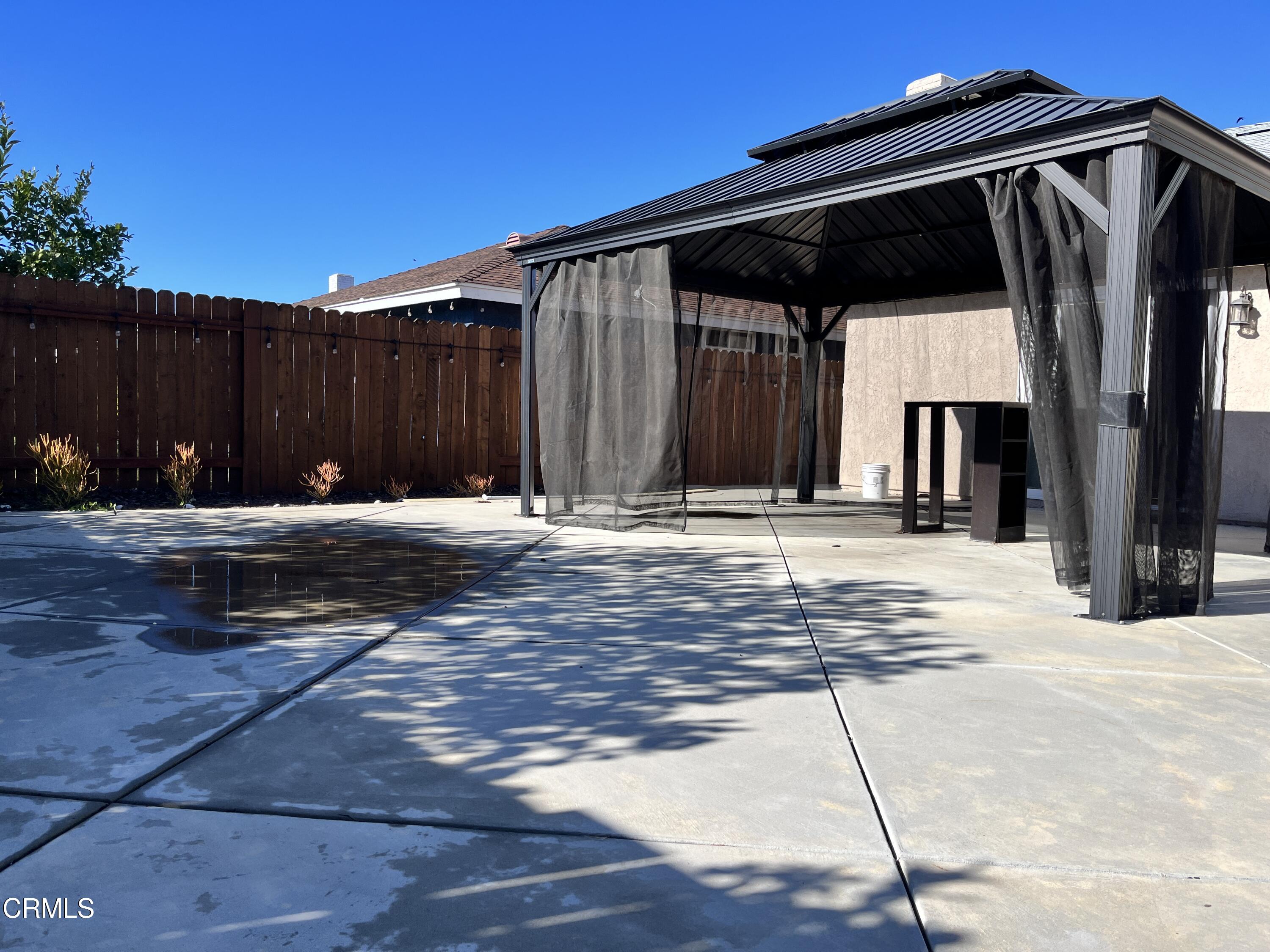 3540 Regatta Place Oxnard, CA 93035 - Photo 16 of 17 a backyard of a house with table and chairs