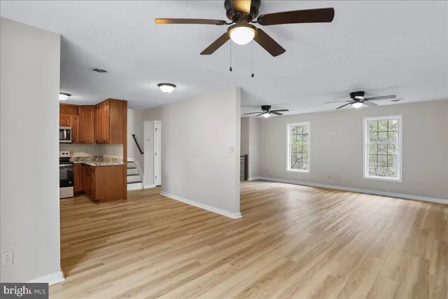 a view of a kitchen with a sink and a window