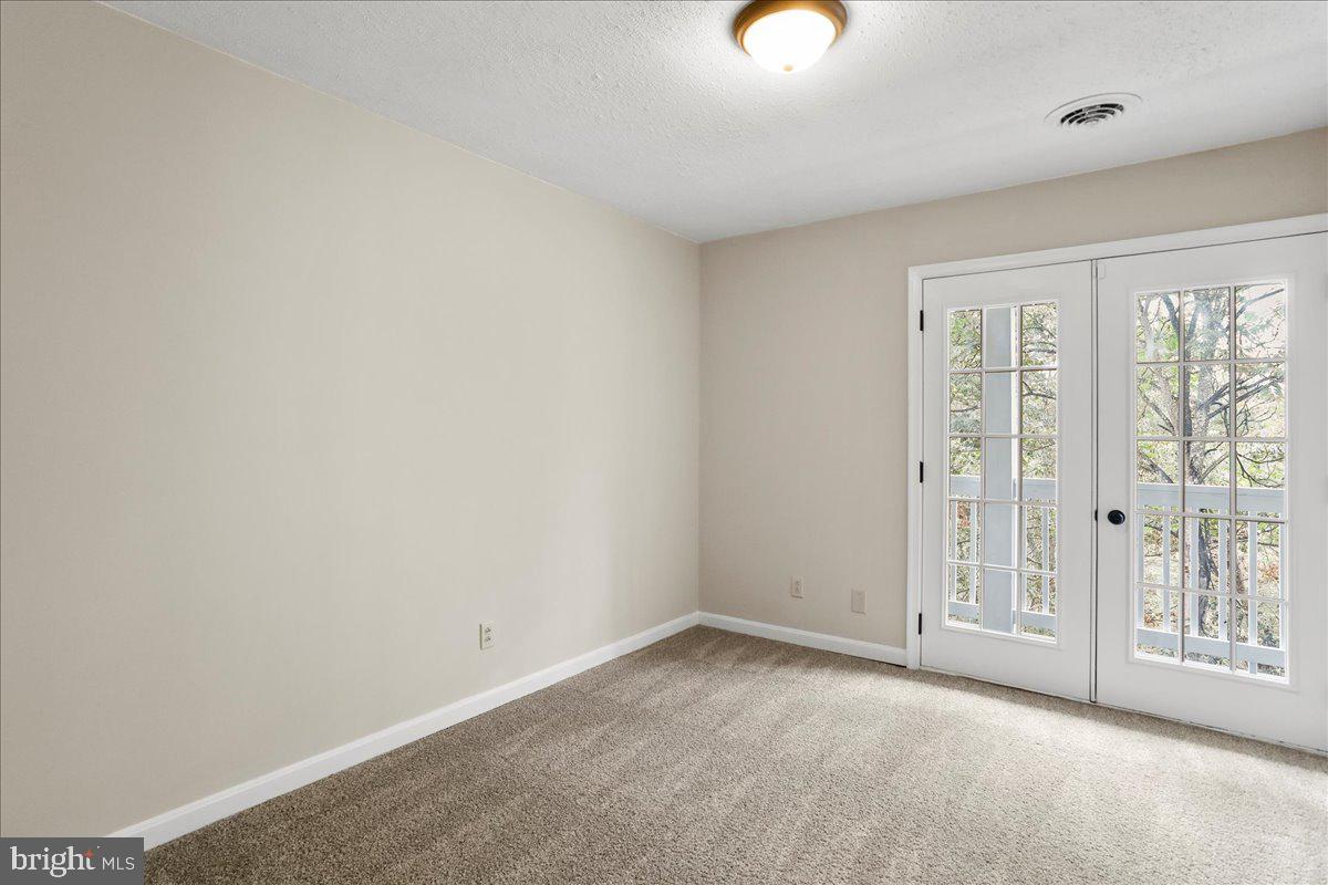 72 Pioneer Lane Berkeley Springs, WV 25411 - Photo 18 of 35 an empty room with windows