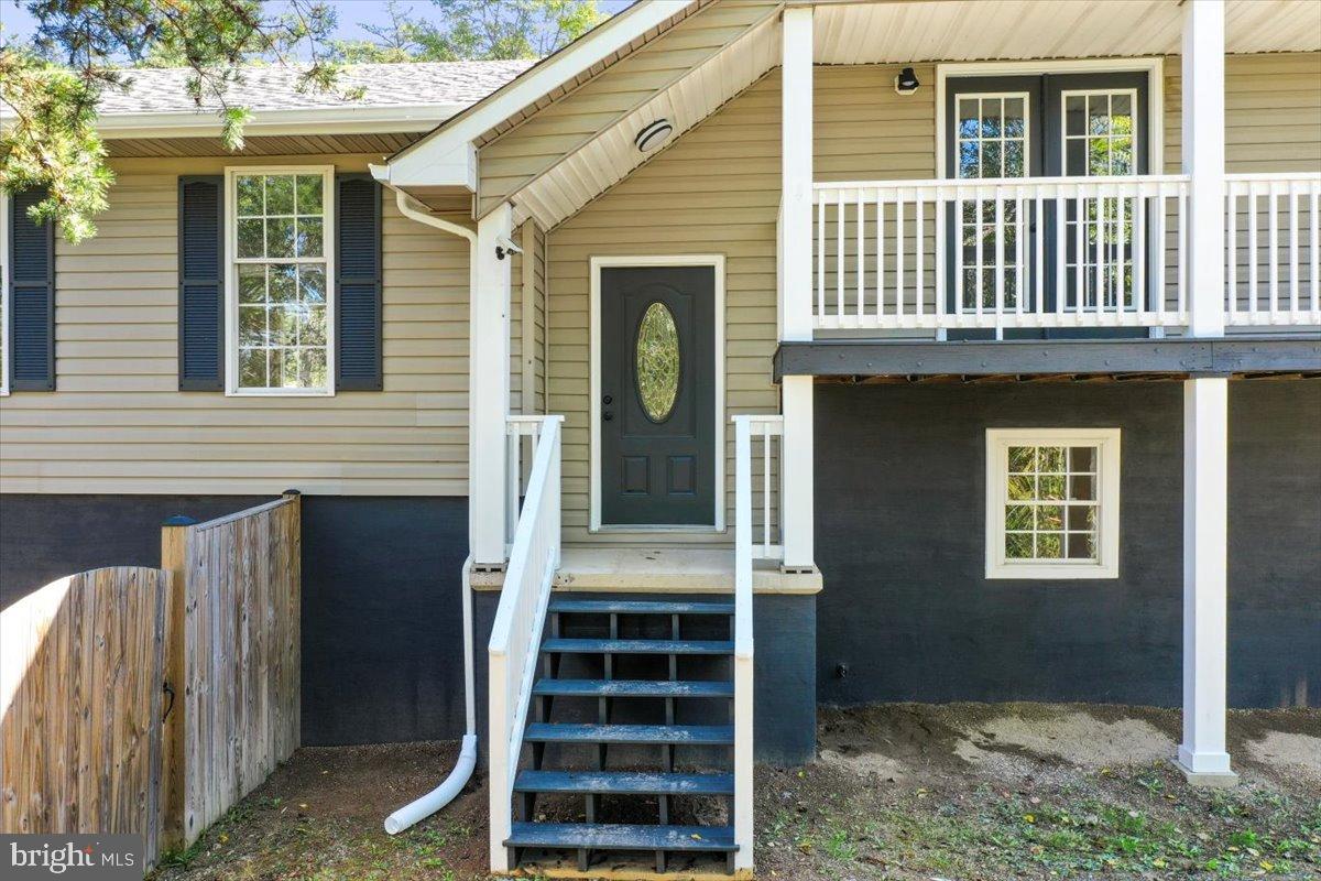72 Pioneer Lane Berkeley Springs, WV 25411 - Photo 2 of 35 front view of a house with a window
