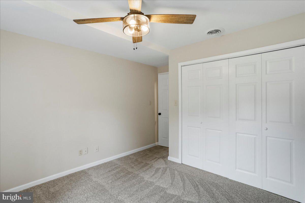 72 Pioneer Lane Berkeley Springs, WV 25411 - Photo 24 of 35 an empty room with a chandelier fan