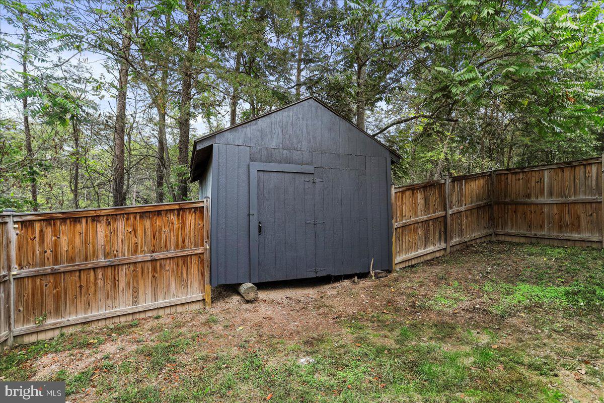 72 Pioneer Lane Berkeley Springs, WV 25411 - Photo 27 of 35 a backyard of a house with wooden fence