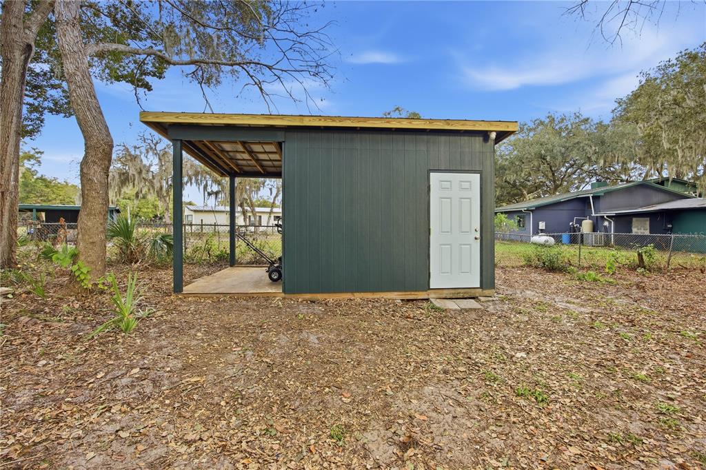 23422 Northeast 154th Place Road Salt Springs, FL 32134 - Photo 18 of 29 a front view of a house with a yard