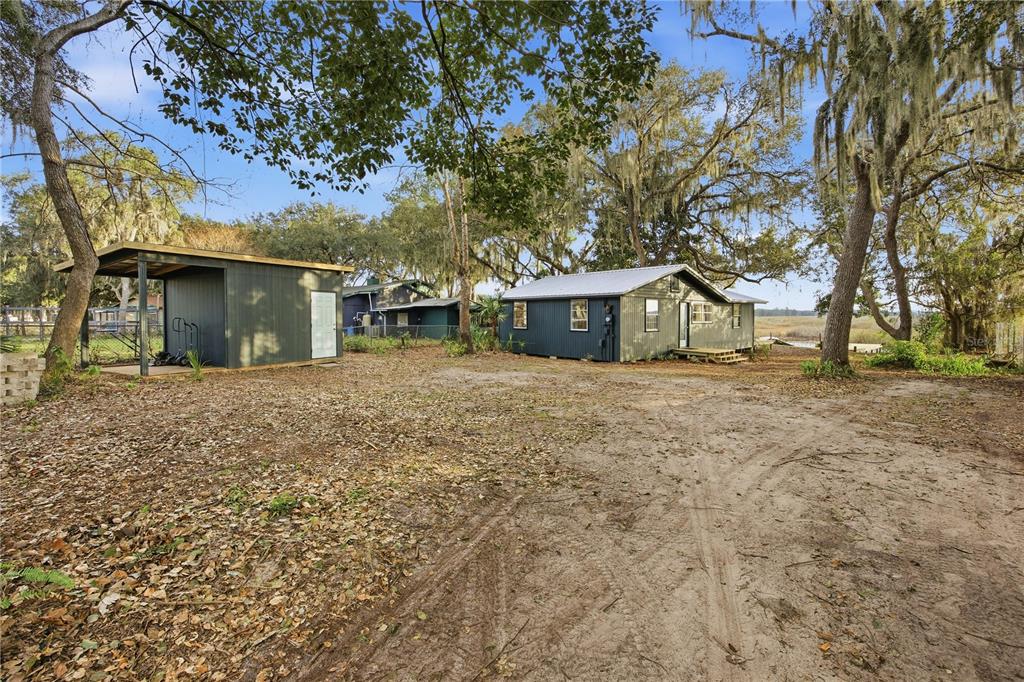 23422 Northeast 154th Place Road Salt Springs, FL 32134 - Photo 28 of 29 a view of a house with a yard