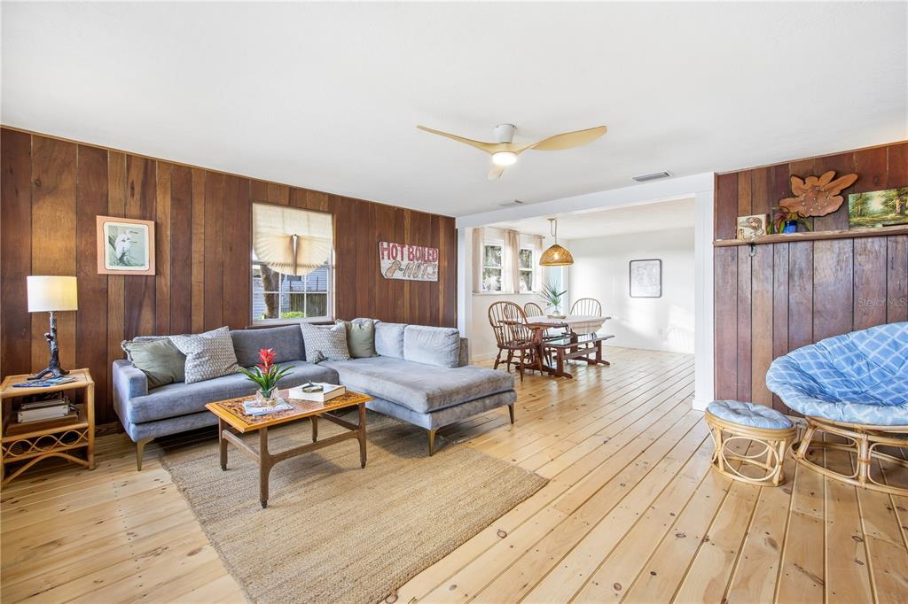 23422 Northeast 154th Place Road Salt Springs, FL 32134 - Photo 5 of 29 a living room with furniture and a wooden floor