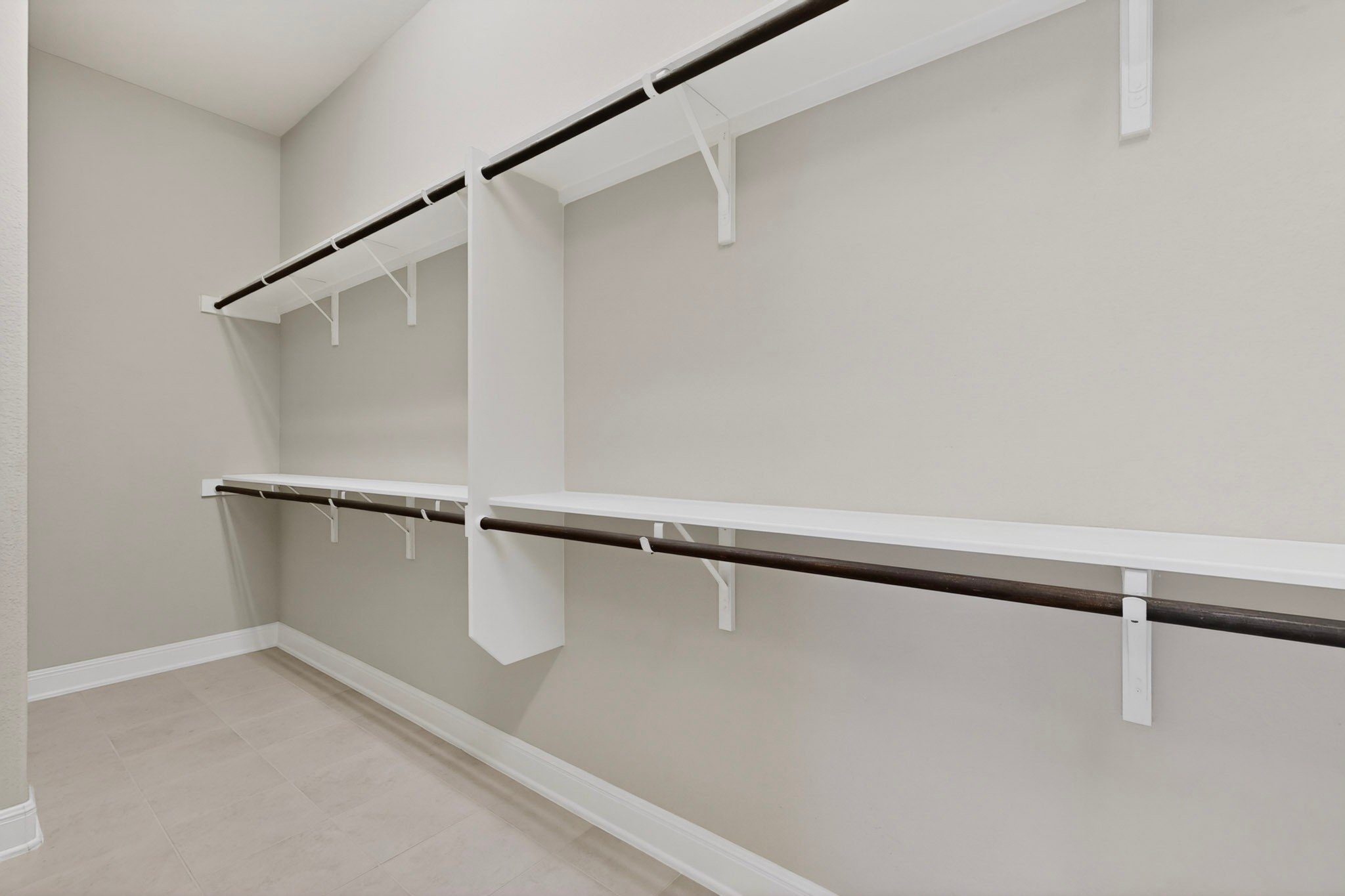 2617 Milan Meadows Drive Leander, TX 78641 - Photo 16 of 40 Ample shelving and hanging space characterize this organized walk-in closet.