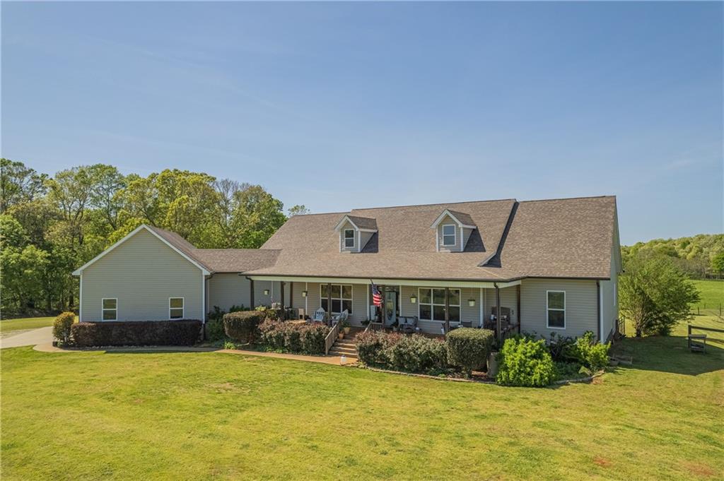 a front view of a house with a yard