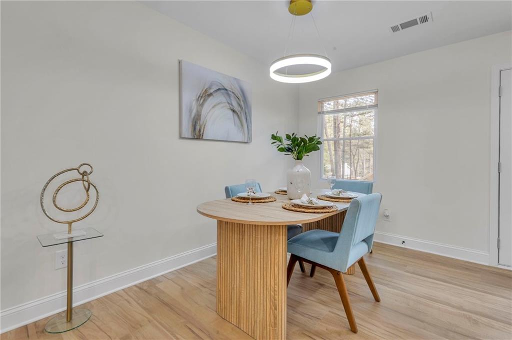 6788 Collier Way Riverdale, GA 30296 - Photo 12 of 37 a view of a workspace room with furniture and wooden floor