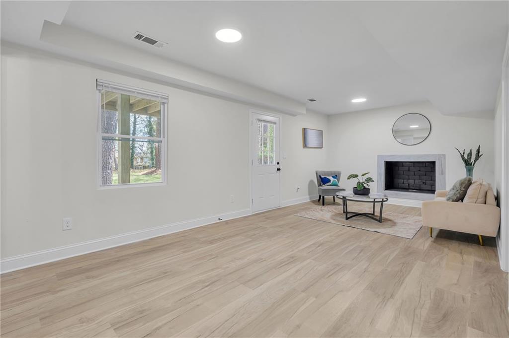 6788 Collier Way Riverdale, GA 30296 - Photo 23 of 37 a living room with furniture and a fireplace