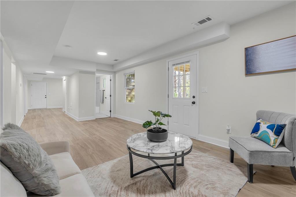 6788 Collier Way Riverdale, GA 30296 - Photo 25 of 37 a living room with furniture and a potted plant