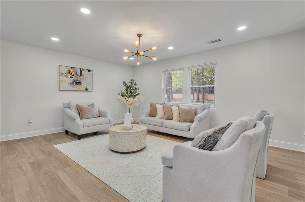 6788 Collier Way Riverdale, GA 30296 - Photo 3 of 37 a living room with furniture and a large window