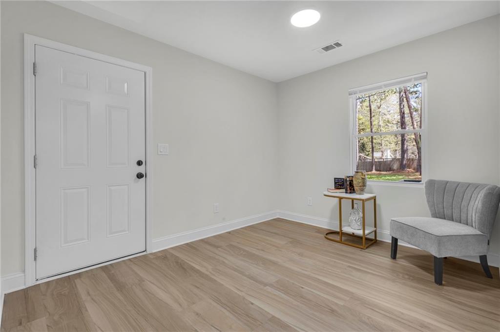 6788 Collier Way Riverdale, GA 30296 - Photo 31 of 37 a view of a livingroom with a window and wooden floor