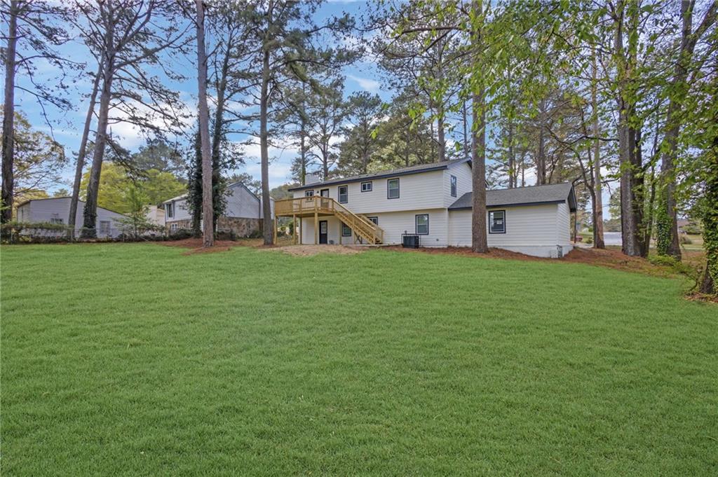 6788 Collier Way Riverdale, GA 30296 - Photo 34 of 37 a view of a house with a yard and tree