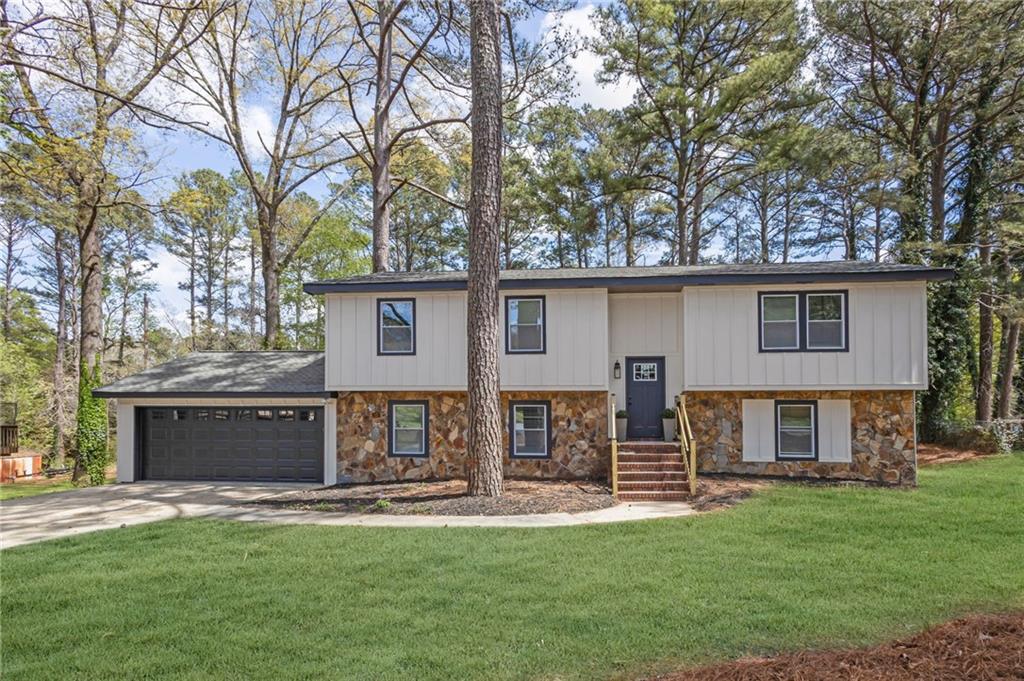 6788 Collier Way Riverdale, GA 30296 - Photo 35 of 37 front view of a house with a yard