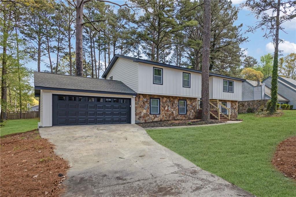 6788 Collier Way Riverdale, GA 30296 - Photo 36 of 37 a view of a house with a yard and large tree