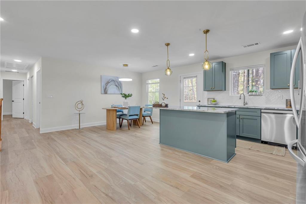 6788 Collier Way Riverdale, GA 30296 - Photo 7 of 37 a view of kitchen with cabinets and wooden floor