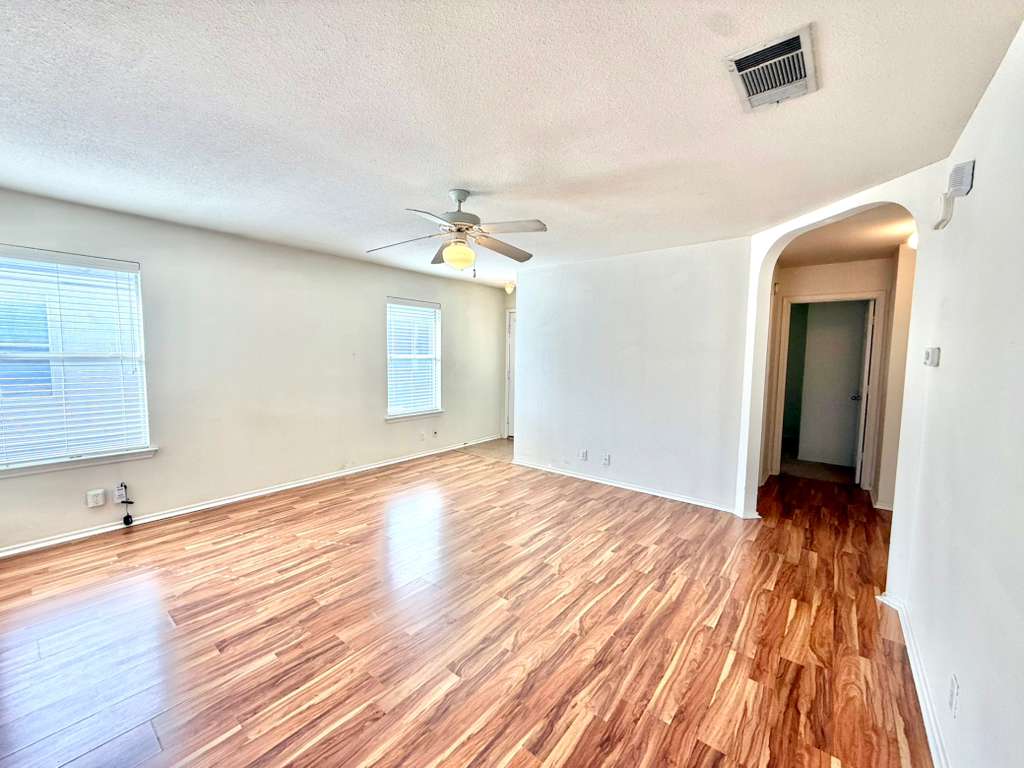 8501 Shallot Way Austin, TX 78748 - Photo 13 of 26 wooden floor in an empty room with a window