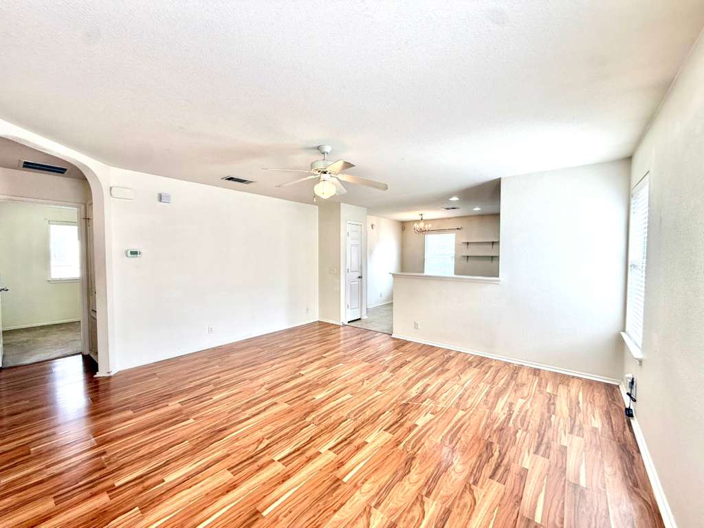8501 Shallot Way Austin, TX 78748 - Photo 15 of 26 a view of empty room with wooden floor
