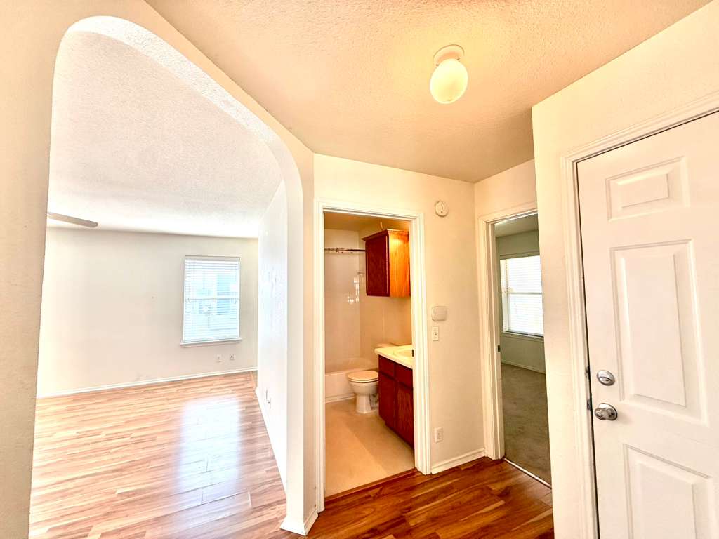 8501 Shallot Way Austin, TX 78748 - Photo 19 of 26 a view of a bedroom with wooden floor and bedroom