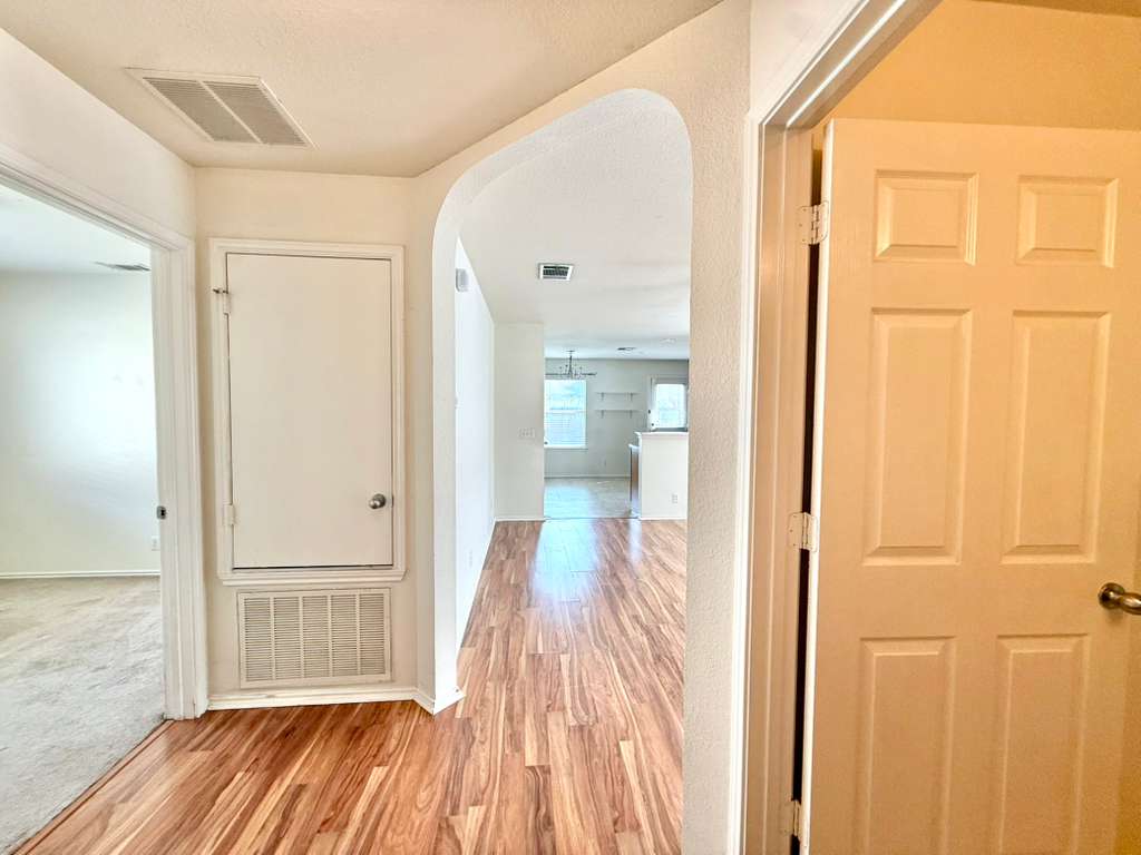 8501 Shallot Way Austin, TX 78748 - Photo 20 of 26 a view of a room with wooden floor and a bathroom