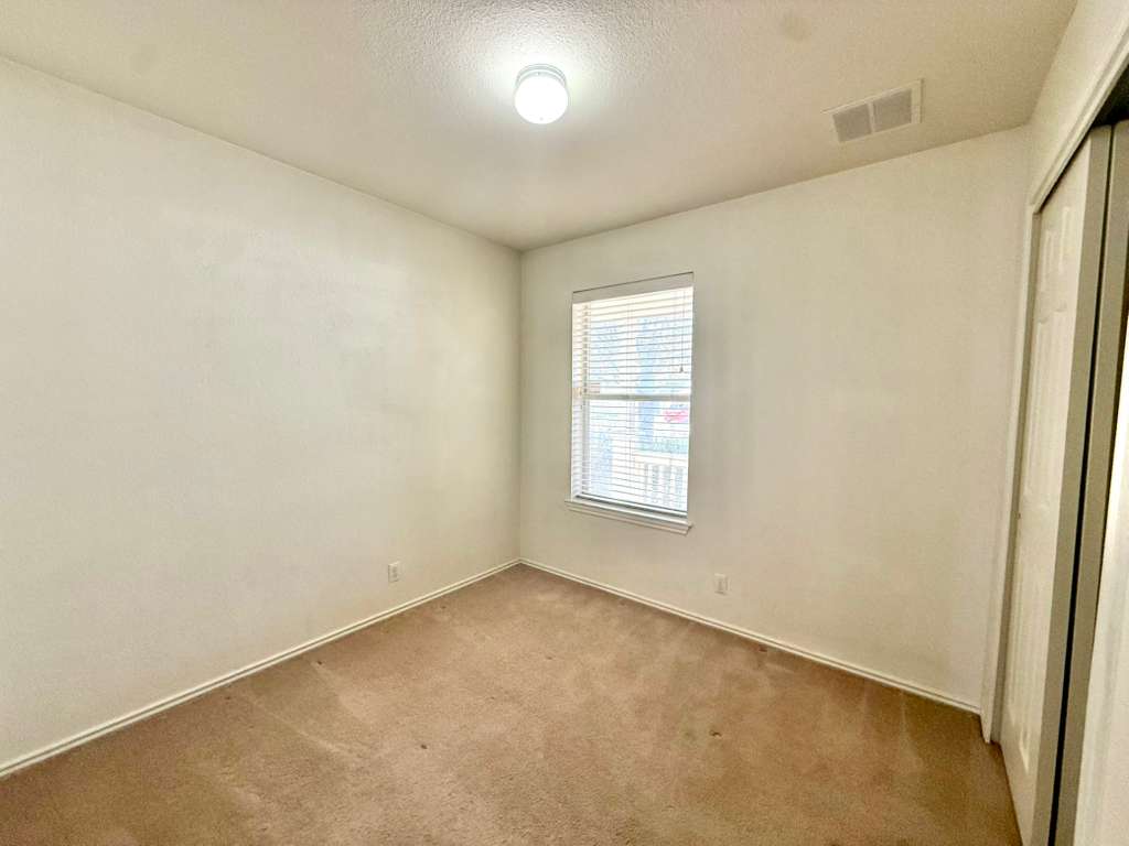 8501 Shallot Way Austin, TX 78748 - Photo 21 of 26 an empty room with a empty space and windows