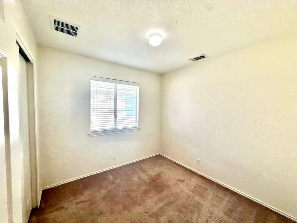 8501 Shallot Way Austin, TX 78748 - Photo 22 of 26 an empty room with windows