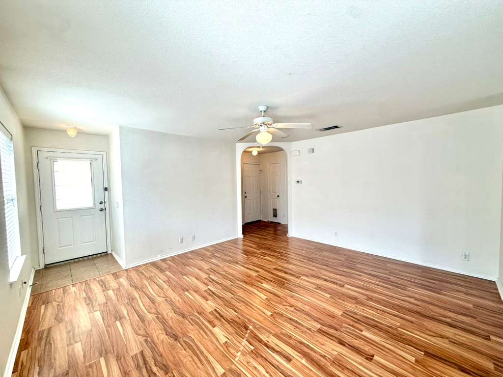 8501 Shallot Way Austin, TX 78748 - Photo 9 of 26 a view of an empty room with wooden floor