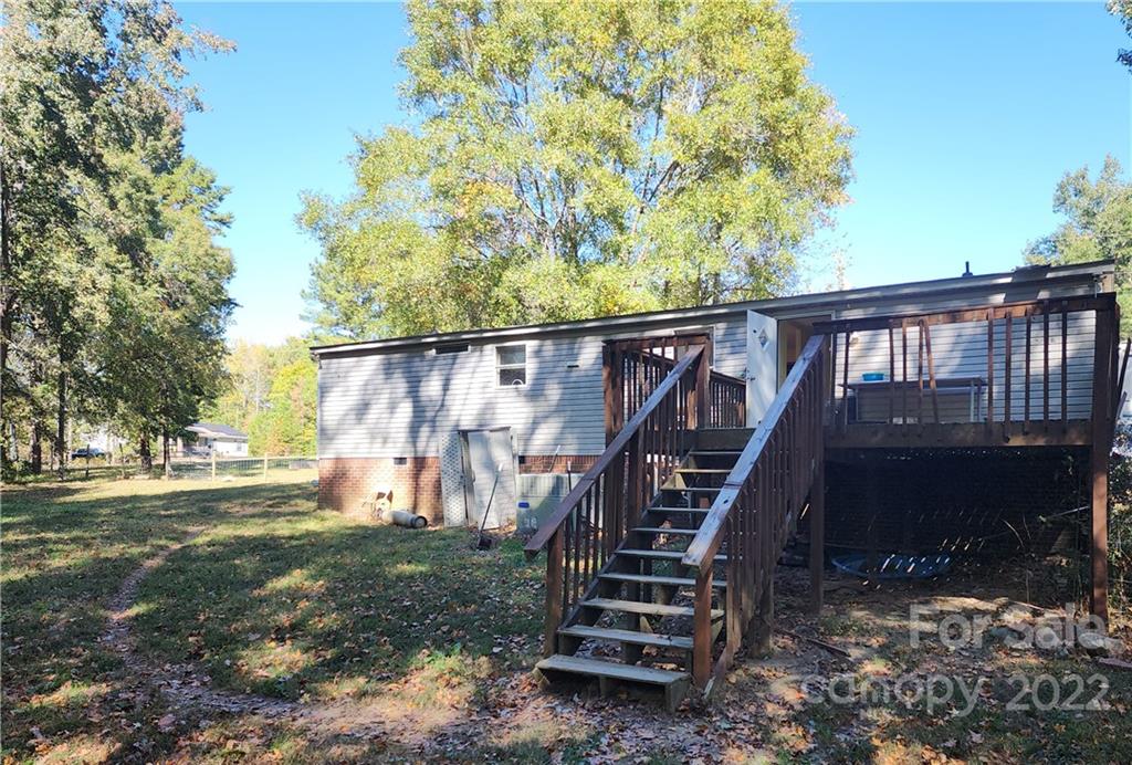 595 Woodglenn Road Catawba, SC 29704 - Photo 15 of 23 a view of backyard with deck and wooden fence