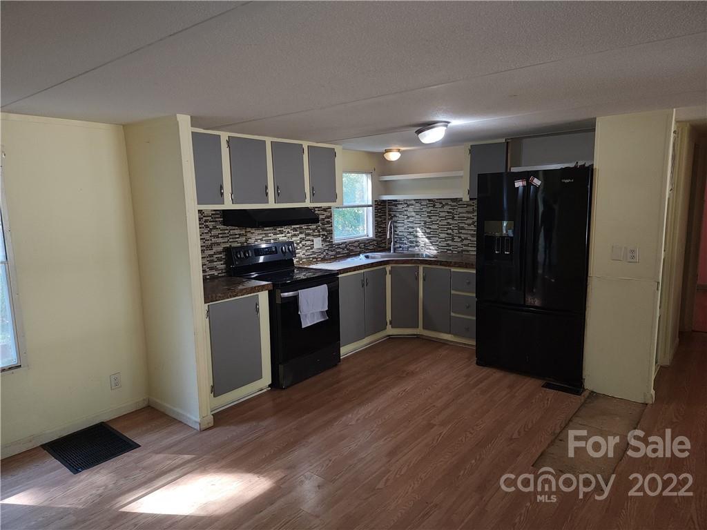 595 Woodglenn Road Catawba, SC 29704 - Photo 5 of 23 a kitchen with stainless steel appliances granite countertop a refrigerator and a stove