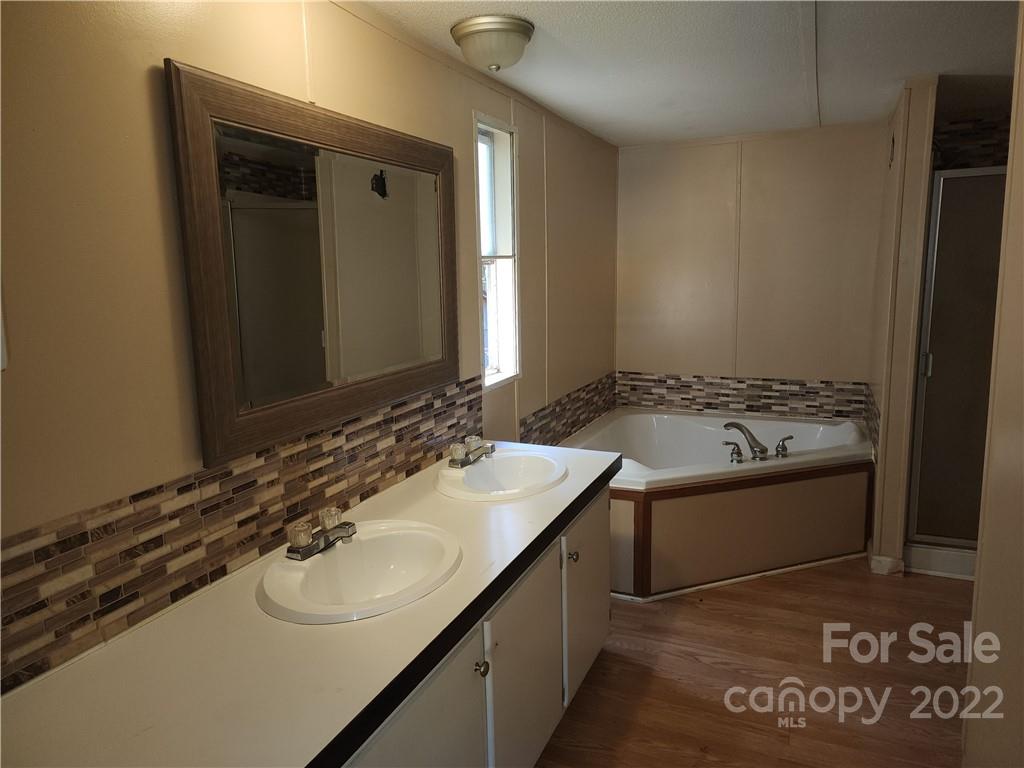 595 Woodglenn Road Catawba, SC 29704 - Photo 8 of 23 a bathroom with a sink and a mirror