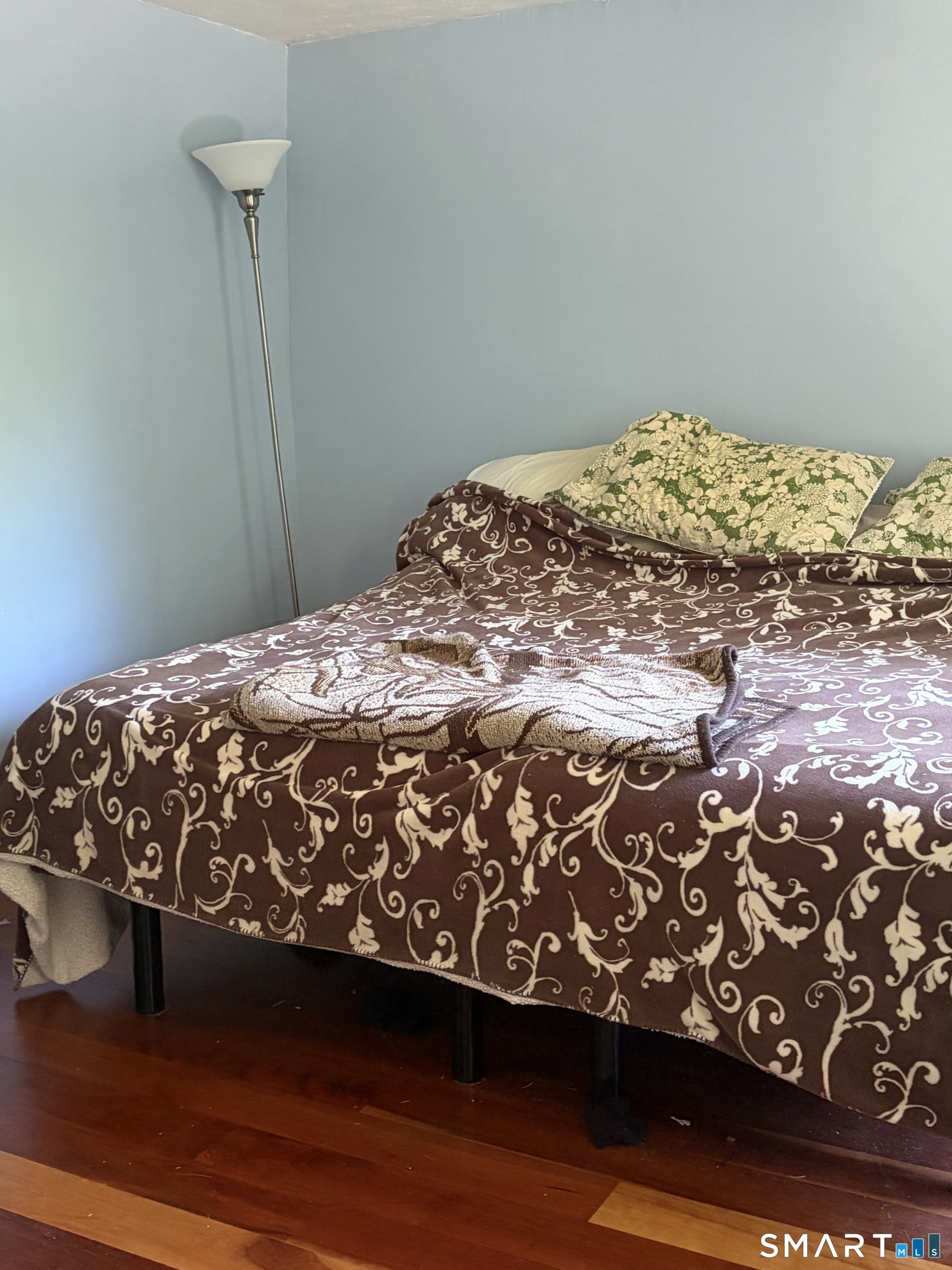 1079 Main Street Coventry, CT 06238 - Photo 15 of 19 a bed sitting in a bedroom next to a wall