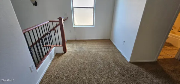 wooden floor with a window in a room