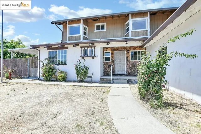 a house view with a garden space