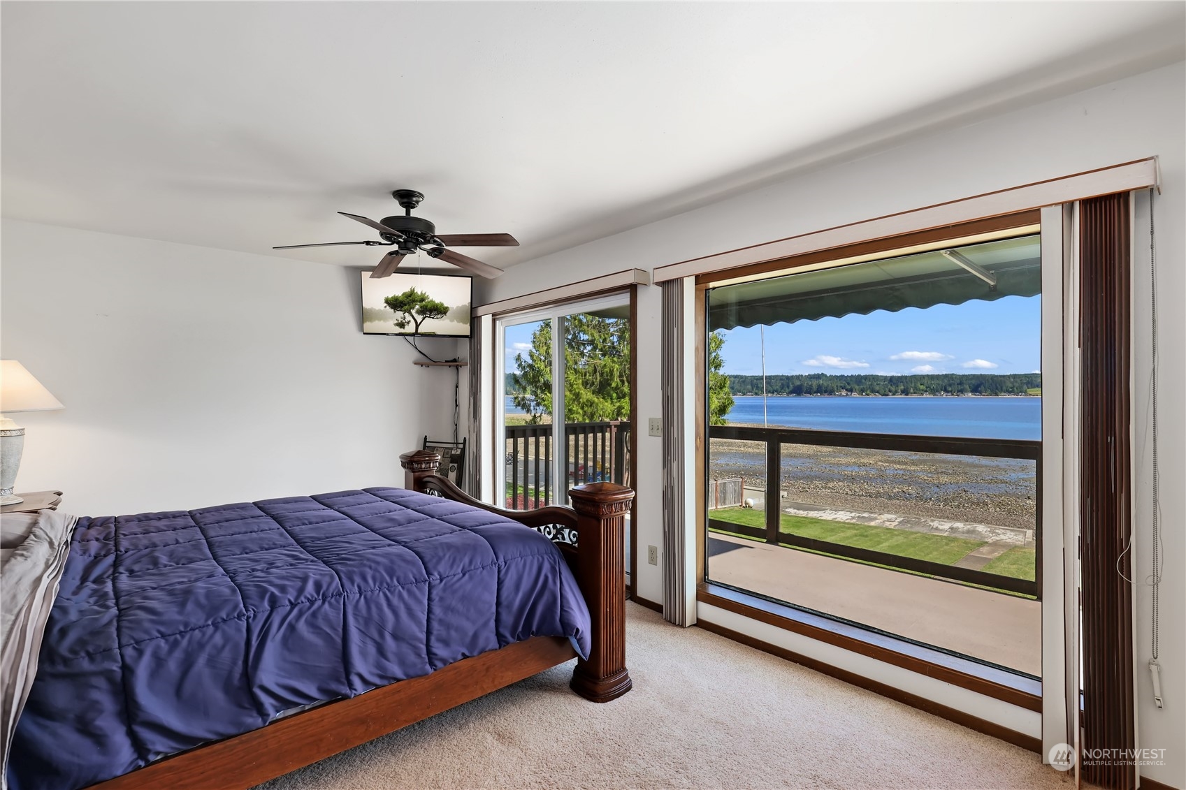 101 Northeast Sundstrom Road Belfair, WA 98528 - Photo 25 of 40 a bedroom with a bed and a window