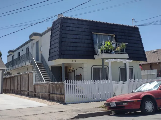 a view of a car park in front of house