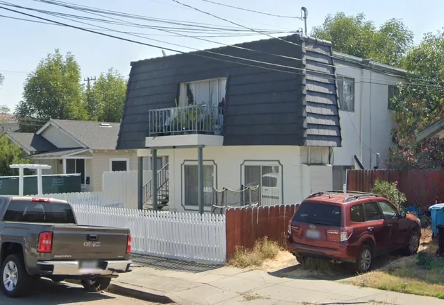 a car parked in front of a house