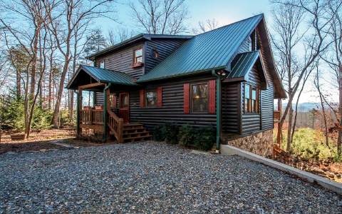 143 Underlook Road Blue Ridge, GA 30513 - Photo 1 of 1 a front view of a house with garden